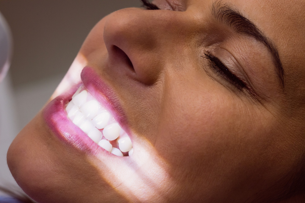 Female patient receiving a teeth whitening treatment