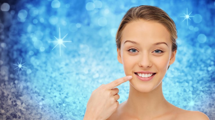 beauty-people-health-concept-happy-young-woman-pointing-finger-her-smile-teeth